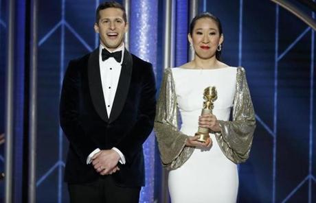 Hosts Andy Samberg and Sandra Oh, who won an award for best TV drama actress.
